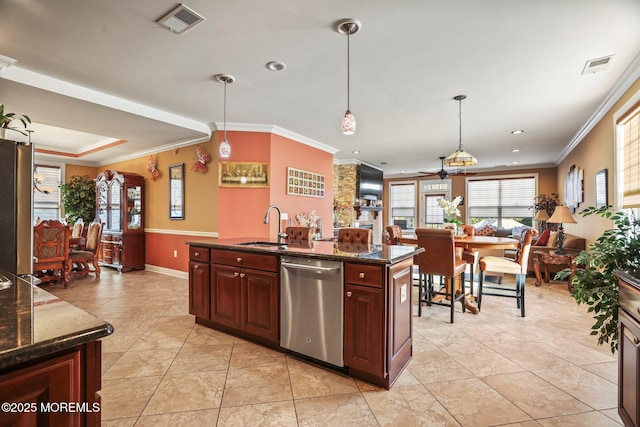 kitchen with decorative light fixtures, dark stone countertops, sink, crown molding, and appliances with stainless steel finishes