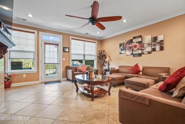 tiled living room featuring ceiling fan and ornamental molding