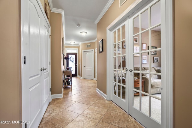 corridor featuring light tile patterned floors, french doors, and ornamental molding