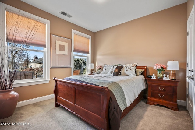 bedroom with light carpet