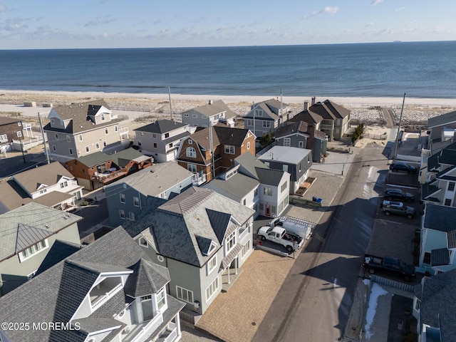 bird's eye view featuring a beach view and a water view