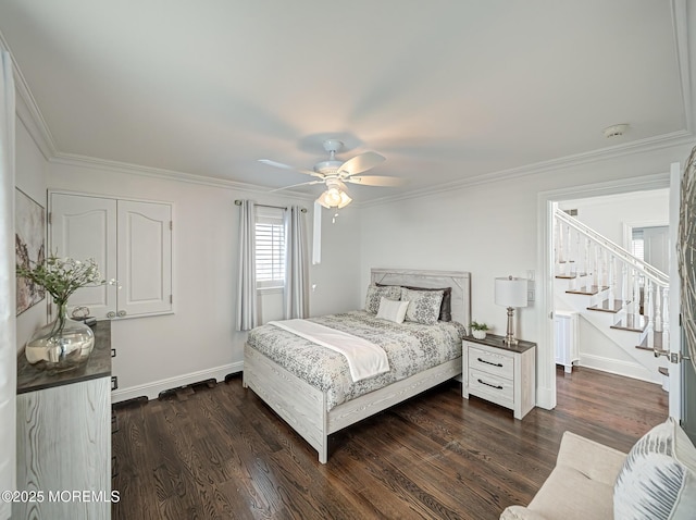 bedroom with ceiling fan, crown molding, and dark hardwood / wood-style flooring