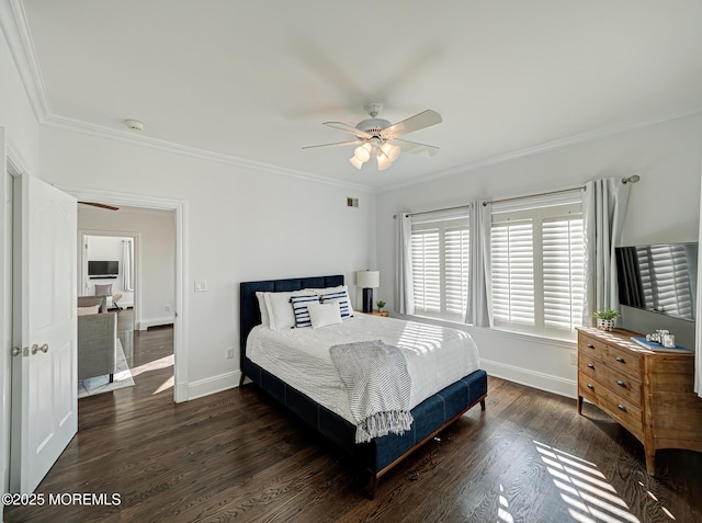 bedroom featuring ceiling fan, crown molding, and dark wood-type flooring