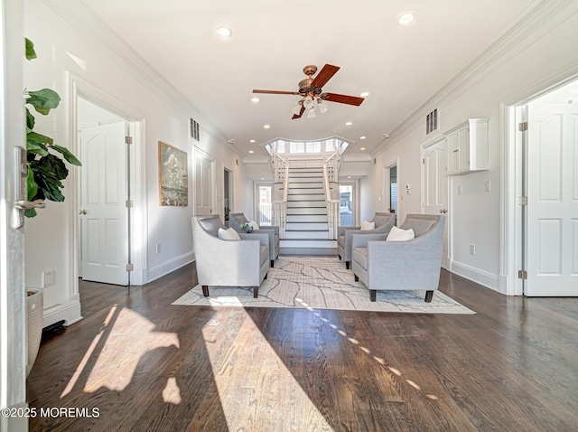 living room featuring ornamental molding, ceiling fan, and hardwood / wood-style floors