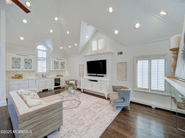 living room with a healthy amount of sunlight, beverage cooler, and wood ceiling