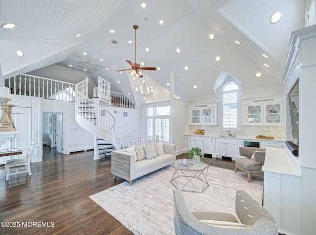 living room featuring sink, dark wood-type flooring, wooden ceiling, and high vaulted ceiling