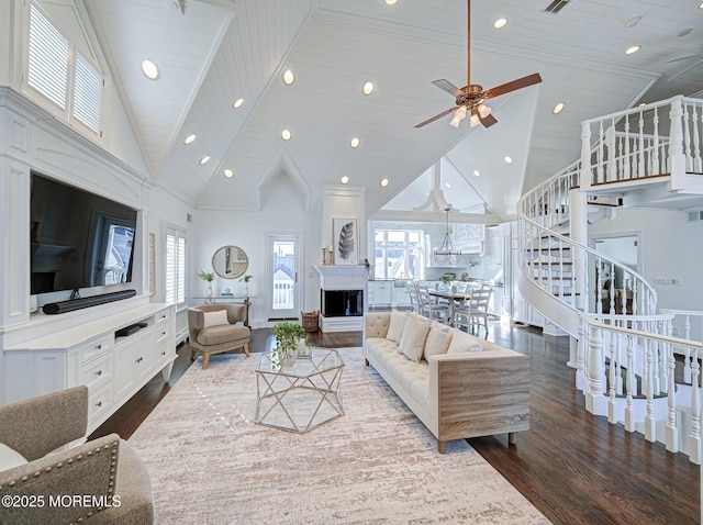 living room featuring high vaulted ceiling, ceiling fan, wood ceiling, and dark hardwood / wood-style floors