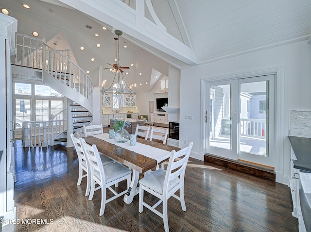 dining space with beam ceiling, a chandelier, high vaulted ceiling, and dark hardwood / wood-style floors