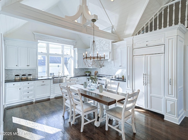 dining room featuring beamed ceiling, high vaulted ceiling, and dark hardwood / wood-style flooring