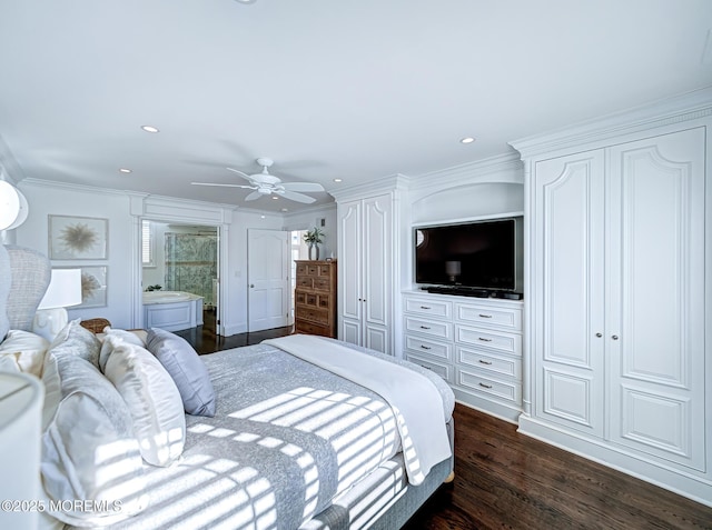 bedroom with ensuite bathroom, ceiling fan, ornamental molding, and dark wood-type flooring