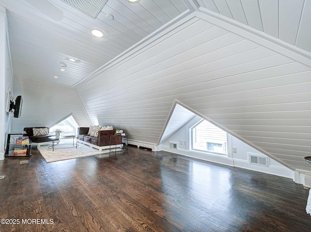 additional living space featuring lofted ceiling and dark hardwood / wood-style floors