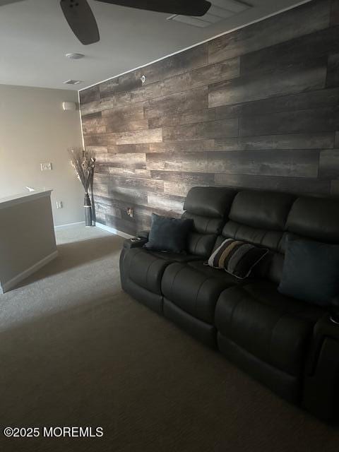 interior space featuring carpet flooring and wooden walls