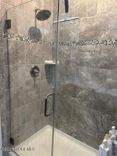 bathroom featuring an enclosed shower