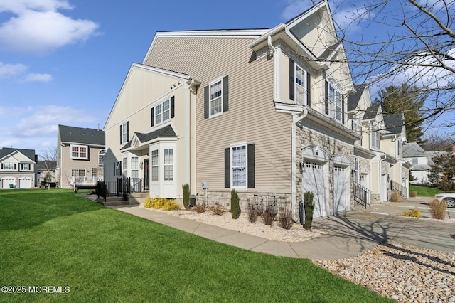 view of home's exterior with a lawn and a garage