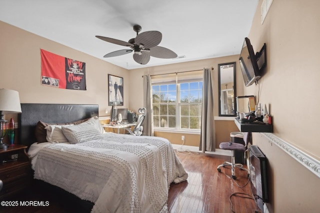 bedroom with ceiling fan and wood-type flooring