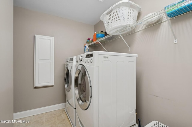 washroom featuring washer and clothes dryer