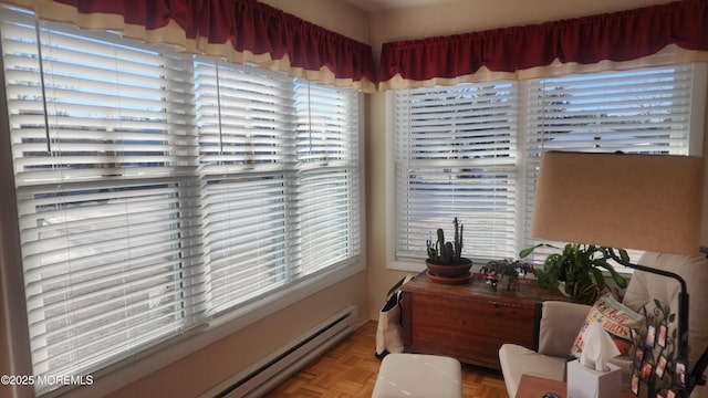 interior space with a baseboard radiator and light parquet flooring