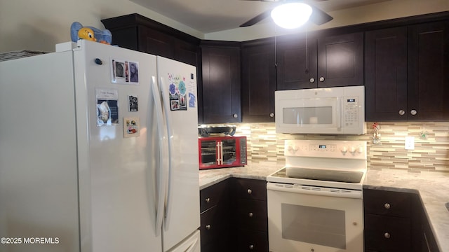 kitchen with white appliances, decorative backsplash, and light stone countertops