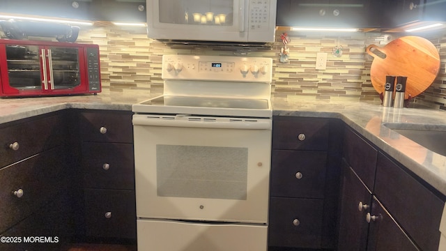 kitchen featuring white appliances and decorative backsplash