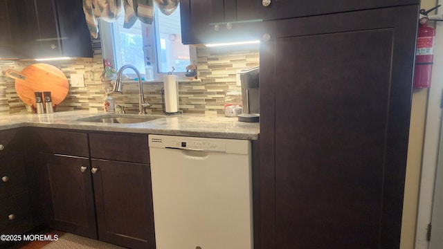 kitchen featuring sink, dishwasher, light stone counters, backsplash, and dark brown cabinets