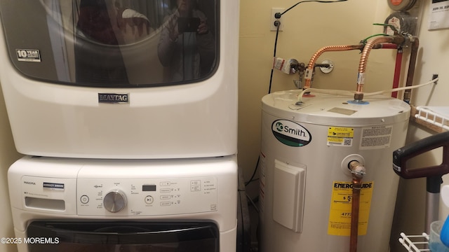 clothes washing area featuring electric water heater