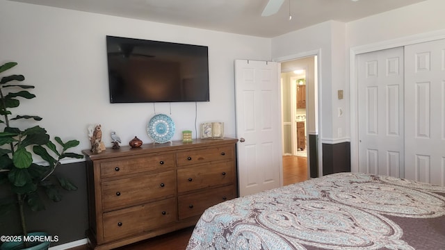 bedroom with ceiling fan and a closet