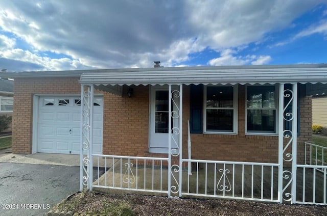 view of front of property with a garage