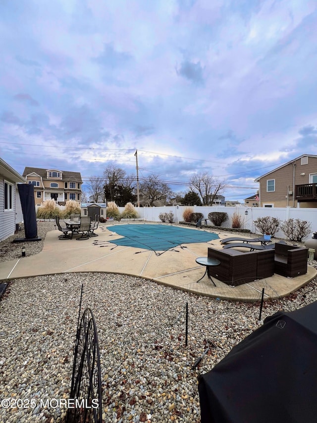 view of swimming pool with a jacuzzi and a patio area