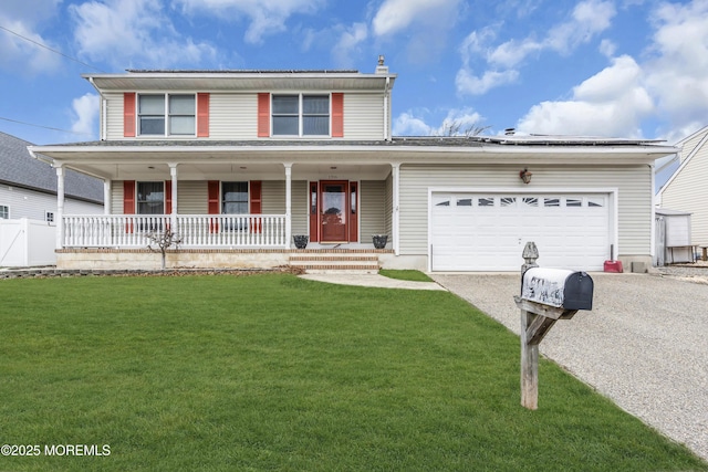 view of front property with a porch, a garage, and a front lawn