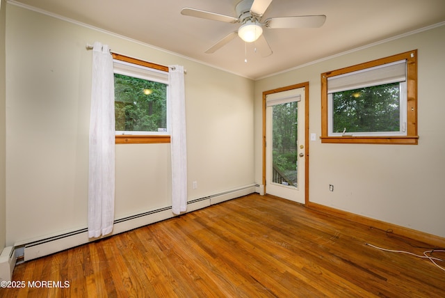 unfurnished room with ceiling fan, hardwood / wood-style floors, and ornamental molding