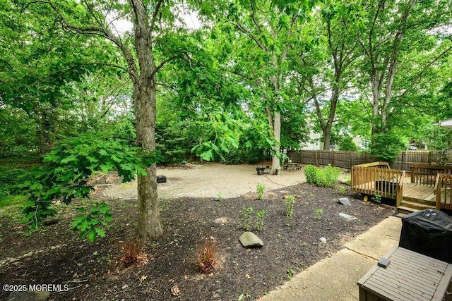 view of yard featuring a wooden deck