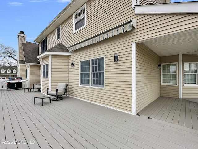 wooden deck with area for grilling