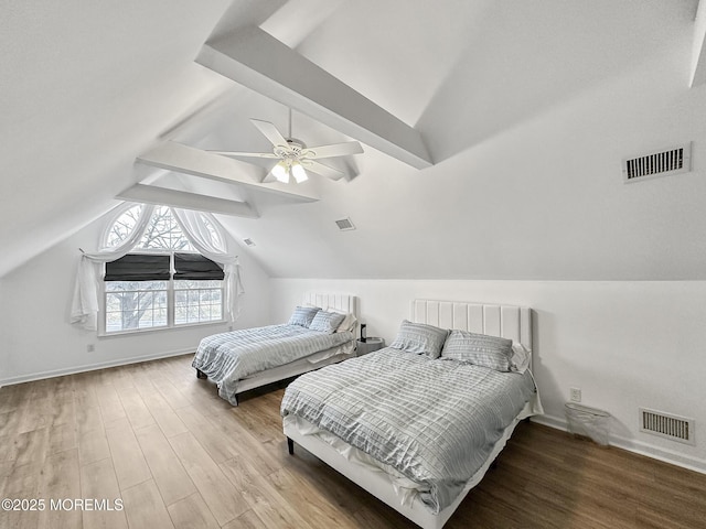 bedroom with vaulted ceiling with beams, hardwood / wood-style flooring, and ceiling fan