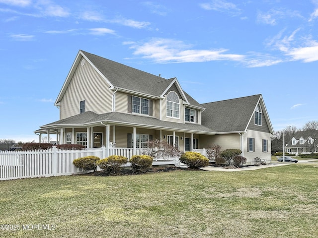 country-style home with covered porch and a front lawn