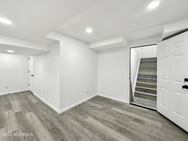 basement with hardwood / wood-style floors