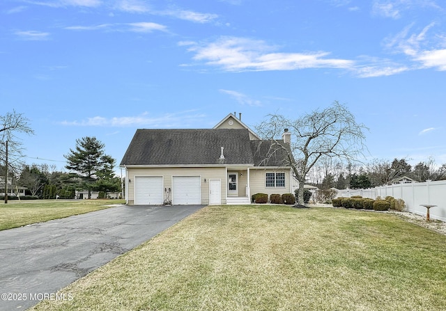 view of front facade featuring a front yard and a garage