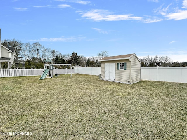 view of yard with a shed and a playground