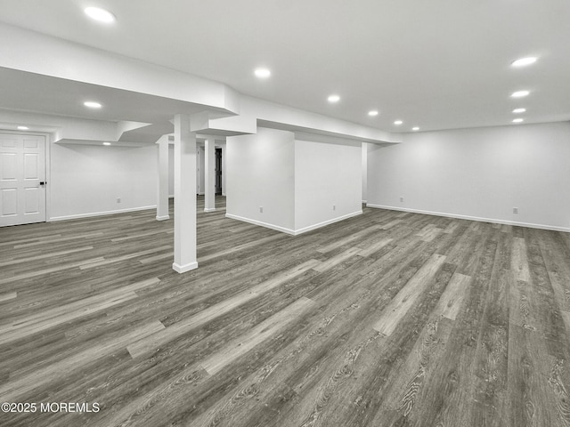 basement featuring dark hardwood / wood-style floors