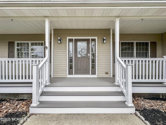 doorway to property with a porch