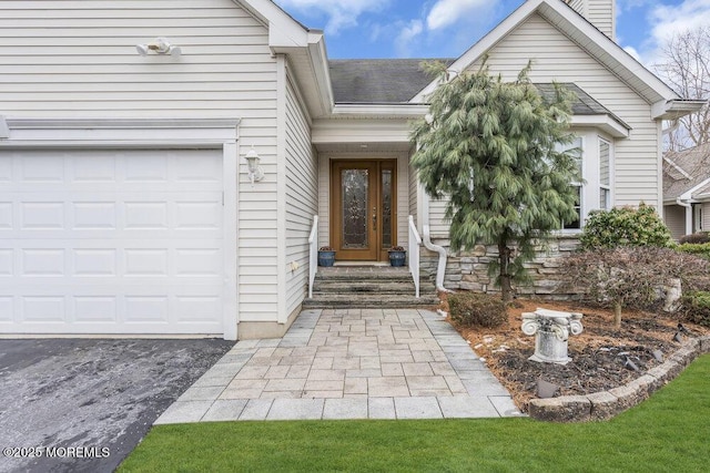 entrance to property featuring a garage