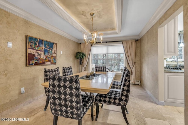 dining room with sink, a notable chandelier, a tray ceiling, and crown molding