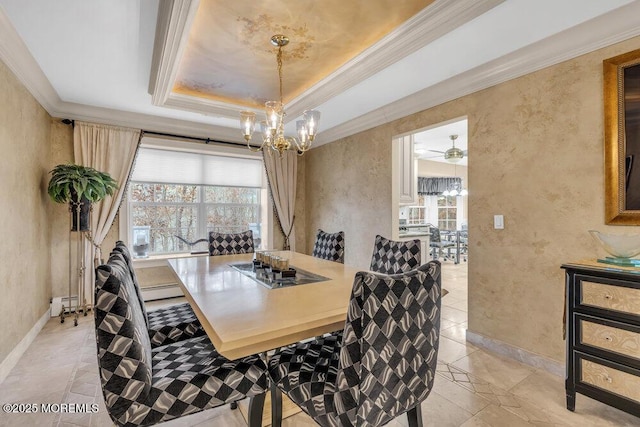 dining space with a baseboard radiator, crown molding, a wealth of natural light, and a tray ceiling