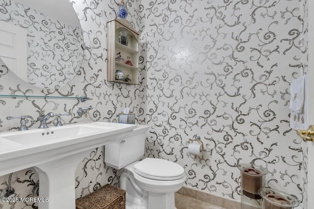 bathroom featuring tile patterned floors and toilet