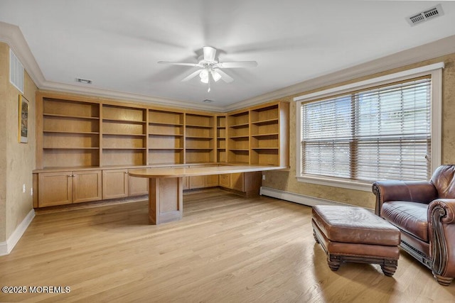 office space featuring ceiling fan, baseboard heating, light wood-type flooring, and crown molding