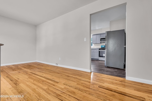 empty room featuring wood-type flooring