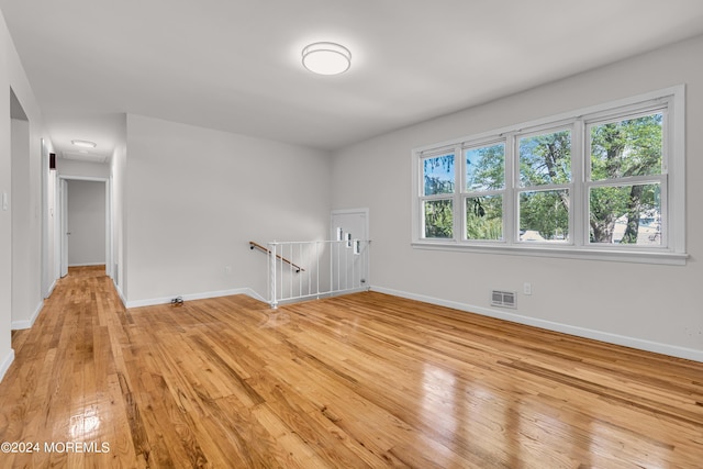 spare room with light hardwood / wood-style floors