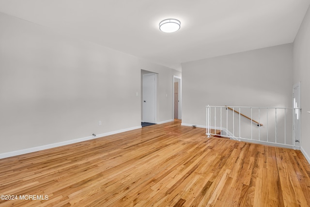 unfurnished room with light wood-type flooring