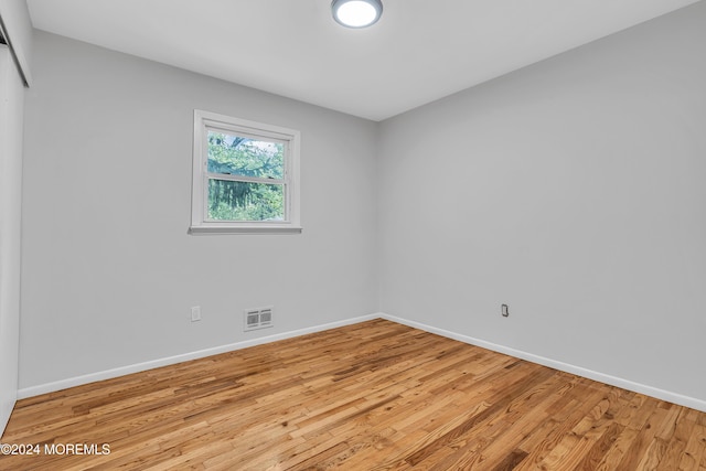 spare room featuring light wood-type flooring