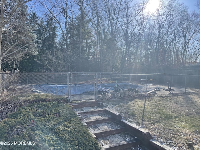 view of yard with a covered pool