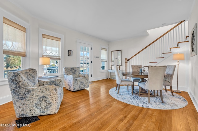 dining area featuring light hardwood / wood-style floors and plenty of natural light